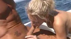 Busty Blonde Rides On Boat