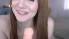Cam Girl Blowing A Toy