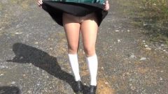 School Girl In White Knee Socks And Black Shoes Under The Dress