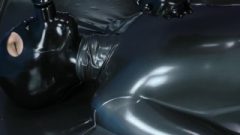 Slut In Latex Catsuit Enters Vacbed , Then Gets Masked And Gagged