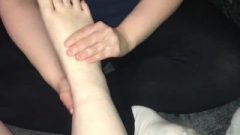 Lesbian Massaging Girlfriend’s Feet With Lotion