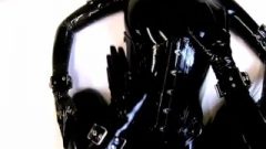 Rubberdoll In Full ebony Latex Enclosure Gets Sprayed Her Mouth With Cum…
